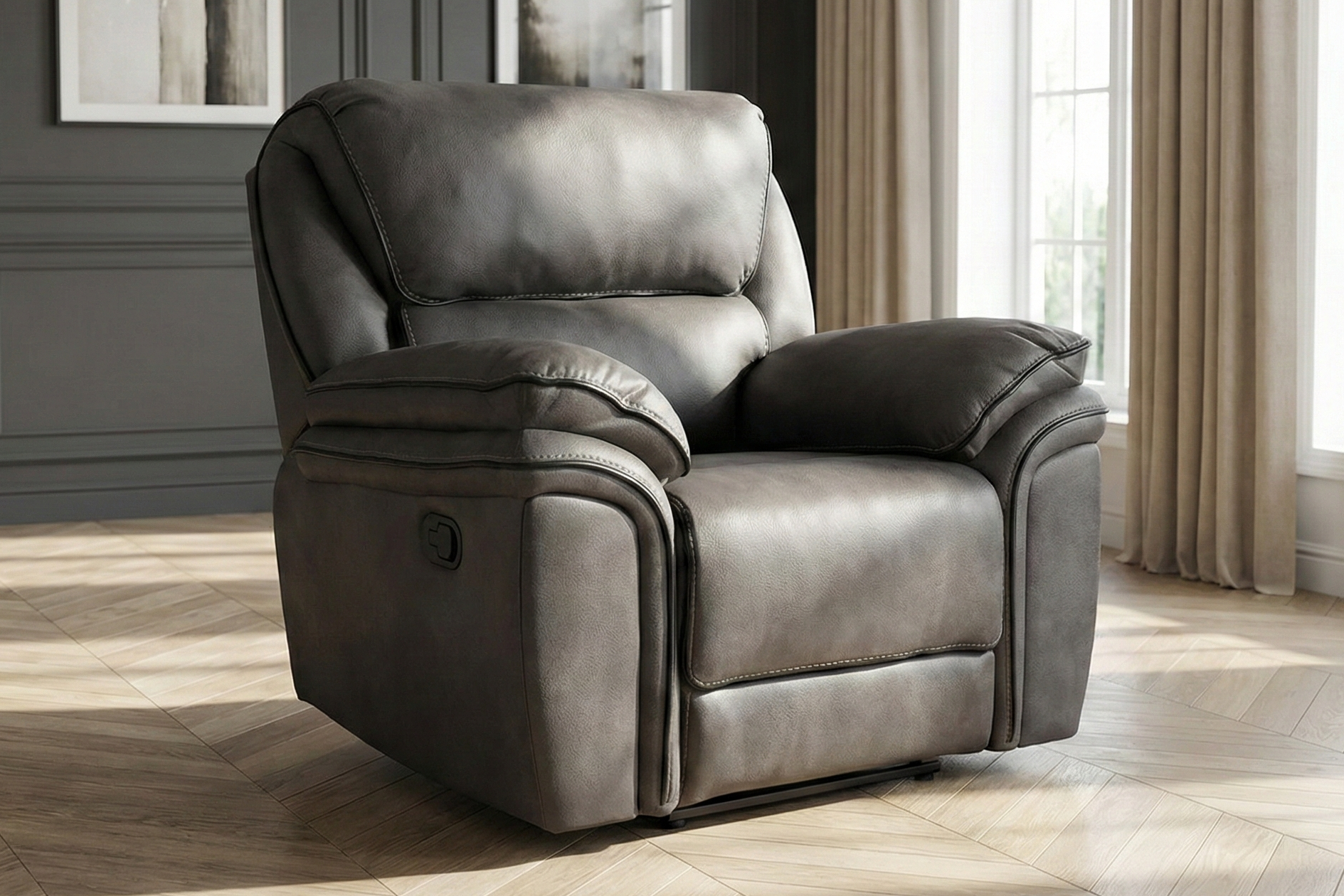 dante furniture monaco recliner armchair grey lifestyle picture Gray recliner chair in a room with dark walls, framed pictures, and large windows.